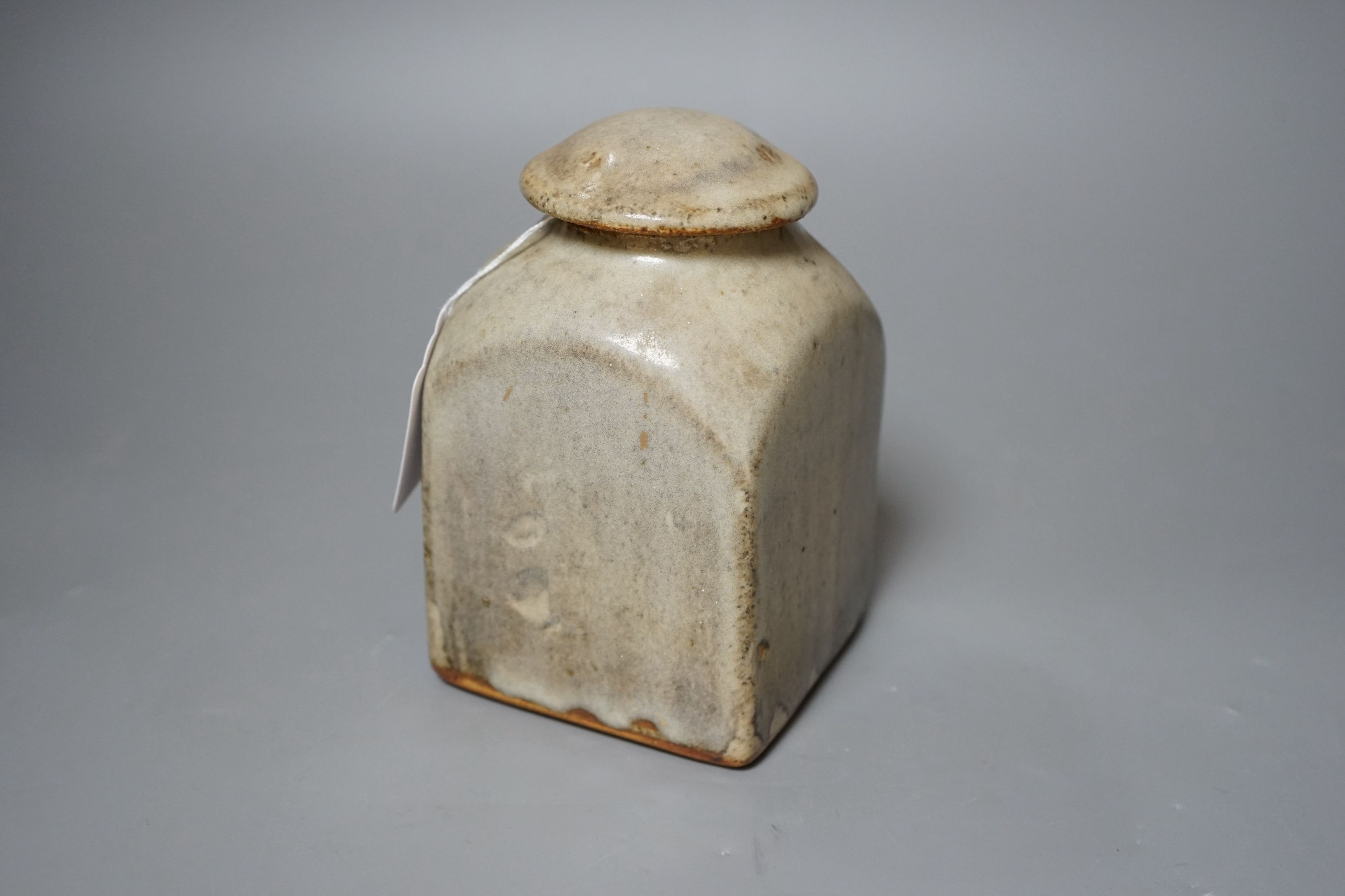 Bernard Leach for St Ives pottery, a mushroom-grey glazed square sided jar and cover, impressed marks to base, 16.5cm tall